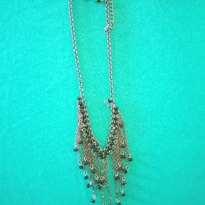 .Black dangly bead necklace with dangly earrings